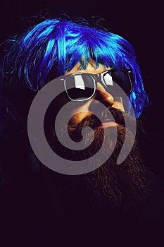 Handsome man in blue wig