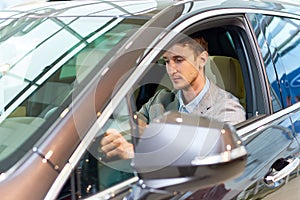 Handsome Man Inside New Car