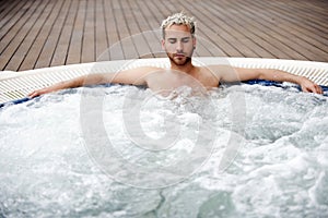 Handsome man in jacuzzi