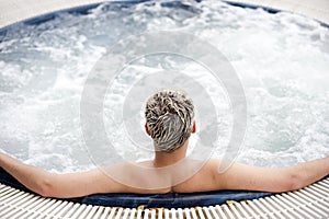 Handsome man in jacuzzi