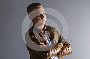 Handsome man in leather jacket looks away