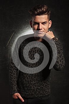 Handsome man in leopard print posing with hand in pocket