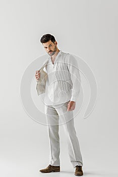 handsome man in linen clothes posing