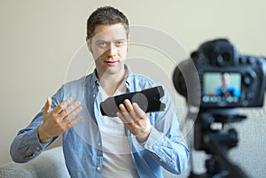 Handsome man making video blog.