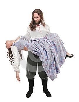 Handsome man in medieval costume holding beautiful woman on his