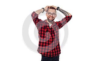 Handsome man model studio portrait. Boy casual style, trendy hipster in checkered shirt look with cool hairstyle