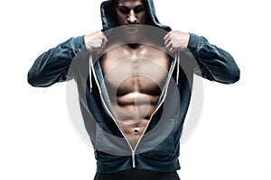 Handsome man with open jacket revealing muscular chest and abs