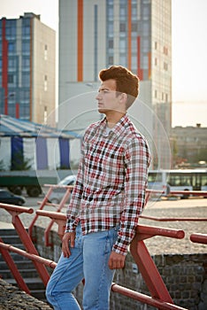 Handsome man outdoors over urban background
