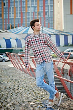 Handsome man outdoors over urban background