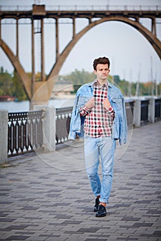 Handsome man outdoors over urban background