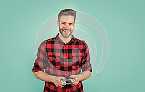 Handsome man play with game console. modern technology and engineering. video game console. guy playing on console. it photo