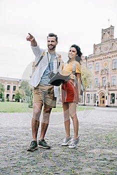 handsome man pointing with finger while