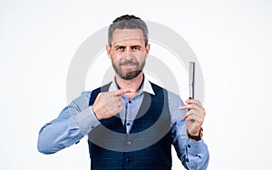 handsome man pointing finger on comb, hair salon