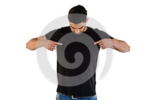 Handsome man pointing at t-shirt