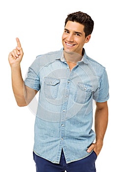 Handsome Man Pointing Up Against White Background