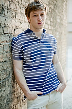 Handsome man in polo shirt relaxing.