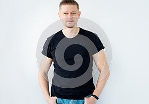 Handsome man posing in black t-shirt