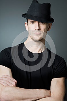 Handsome man posing in black t-shirt and bla