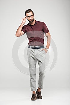 handsome man posing in casual closing and eyeglasses,