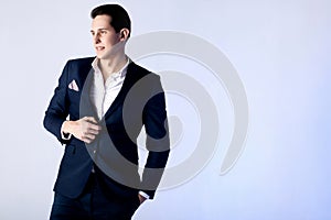 Handsome man posing in suit.