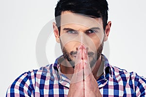 Handsome man praying