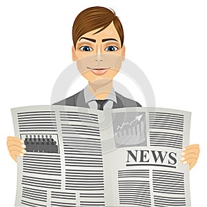 Handsome man reading a newspaper