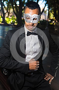 Handsome man ready to attend a masquerade party photo
