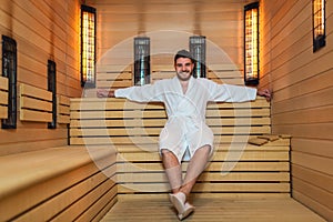 Man relaxing in sauna and staying healthy