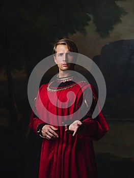 Handsome man in a Royal red doublet.