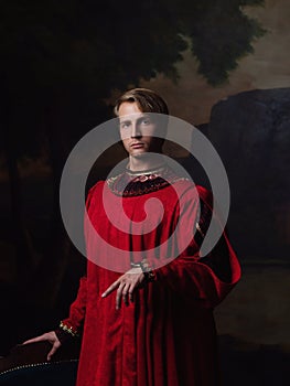 Handsome man in a Royal red doublet.