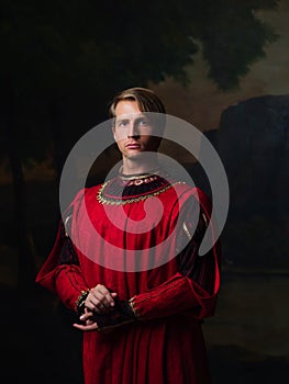 Handsome man in a Royal red doublet.