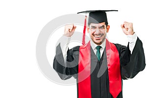 Handsome man screaming with happiness while graduating