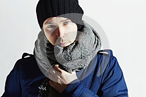 Handsome Man in Scurf. Stylish European Boy with Blue Eyes. Casual Winter Fashion photo