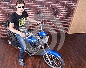 Handsome Man with Shades on his Motorcycle