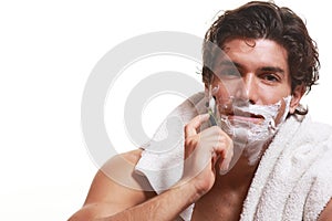 Handsome man shaving