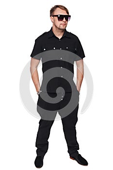 Handsome man in shirt and sunglasses posing in full length with hands in pockets, fashion man. isolated over white background