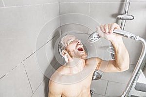 Handsome man in shower