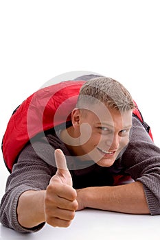 Handsome man in sleeping bag and showing