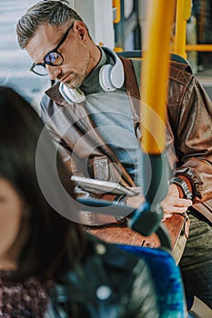 Handsome man sleeping during long bus ride