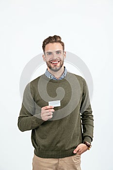 handsome man with stylish hair showing business card isolated on white, copy space, business