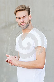 Handsome man stylish hairstyle. Handsome caucasian man gray background. Pensive mood. Ideal traits that make man