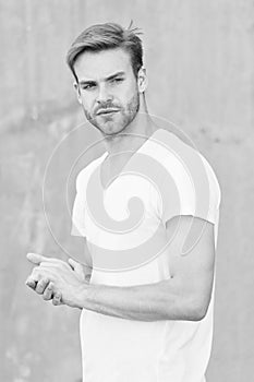 Handsome man stylish hairstyle. Handsome caucasian man gray background. Pensive mood. Ideal traits that make man
