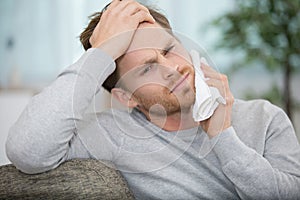 handsome man suffering from toothache