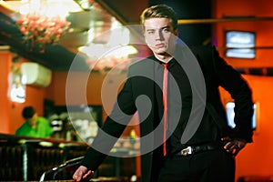 Handsome man in suit at bar