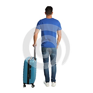 Handsome man with suitcase for summer trip on background, back view. Vacation travel