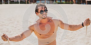 Handsome man at summer day, sexy guy at vacation