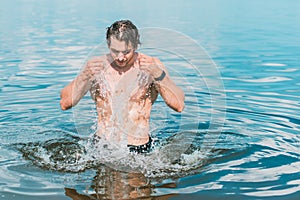 Handsome man at summer day, sexy guy at vacation