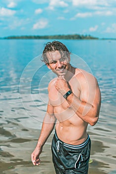 Handsome man at summer day, sexy guy at vacation