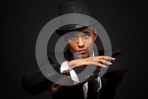 Handsome man in top hat posing with cane