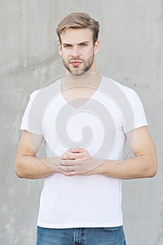 Handsome man unshaven face stylish hairstyle. Handsome caucasian man gray background. Ideal traits that make man